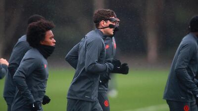 Chelsea's Christian Pulisic (centre) warms up with a mask on during a training session ahead of their Champions Lague game against Bayern Munich. PA