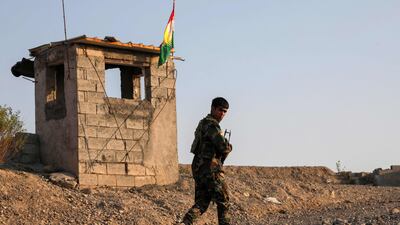 A Kurdish Peshmerga fighter affiliated with the Kurdistan Freedom Party (PAK), mans a position north of Kirkuk, in Iraq's Kurdistan region. AFP