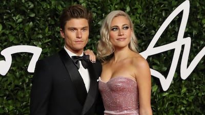 Oliver Cheshire and Pixie Lott arrive at the 2019 British Fashion Awards in London on December 2, 2019. AFP