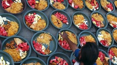 People offer free meals to break the Fast on a road side during Ramadan. For business owners, it is a good time to get more involved in social responsibility projects. Rehan Kahn/EPA