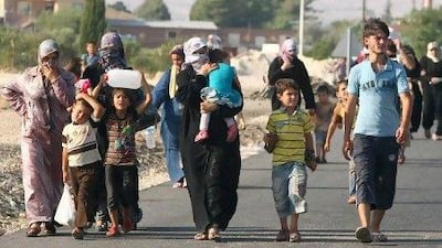 Syrian refugees at the ‘container city’ refugee camp near the Syrian border at Kilis, Turkey. Many refugees fear sectarian violence and political conflicts will result in a period of brutality.