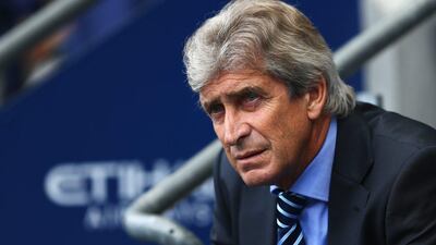Manchester City manager Manuel Pellegrini watches his side's loss to Stoke City on Saturday in the English Premier League. Clive Mason / Getty Images / August 30, 2014