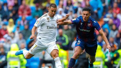 Real Madrid's Eden Hazard in action against Levante's Oscar Duarte. EPA