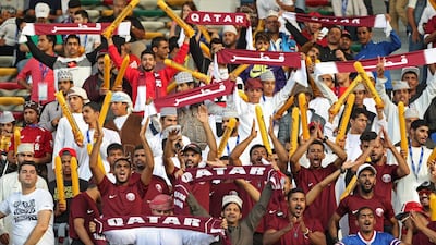 Qatar supporters cheer ahead of the AFC Asian Cup final football match between Japan and Qatar in Abu Dhabi. Karim Sahib / AFP