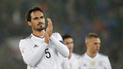 Germany's Mats Hummels applauds his side's supporters after the World Cup Group C qualifying football match between Northern Ireland and Germany at Windsor Park in Belfast. Peter Morrison/ AP Photo