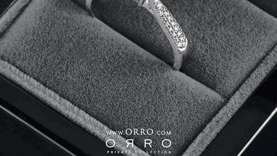 Round brilliant-cut ring half-paved with smaller stones, from Orro 