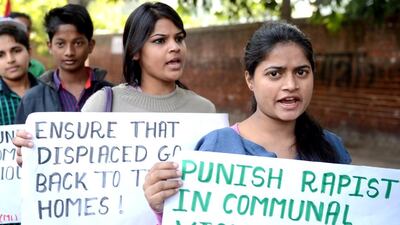 Supporters of the Communist Party of India shout slogans during a demonstration against a gang rape in Muzafarnagar in New Delhi. Raveendran / AFP