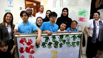 Hessa Buhumaid, Minister of Community Development, (second right, back) inaugurates Dubai Down Syndrome Centre. Courtesy Ministry of Community Development