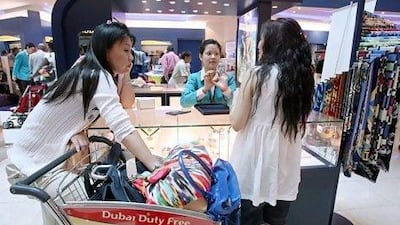 Dubai Duty Free is processing paperwork for more than 150 Chinese recruits to come to work at its outlet, as the airport attracts more visitors from the country. Randi Sokoloff / The National