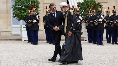 France's President Emmanuel Macron shakes hands with Oman's Sultan Haitham ahead of a meeting at the Elysee Palace in Paris. Reuters
