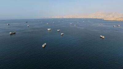 Ships anchored off the coast of Khasab in Oman’s Musandam, near the Strait of Hormuz, on October 2. AFP
