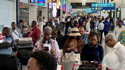Passengers queue at Dubai International Airport following Iran's Monday attack on a US military base in Qatar. Reuters
