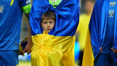A mascot is wrapped in the colours of the Ukrainian flag before the country's Uefa Nations League football match against the Republic of Ireland in Lodz, Poland. Reuters