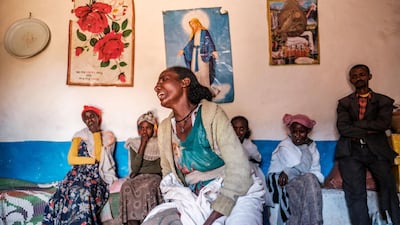 A woman cries in her home as a group of relatives look on in the village of Dengolat, north of Mekele, the capital of Tigray, where the UN says widespread murder, rape and looting are taking place. AFP