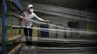An employee works at a textile factory in Wuhan, Hubei province. Activity in China's factories increased marginally in April but export orders fell sharply, a government survey showed. Reuters