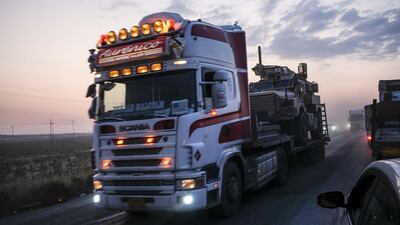 A convoy of U.S. armored military vehicles leave Syria on a road to Iraq. Getty Images