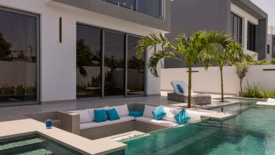 A sunken seating area with firepit in the garden