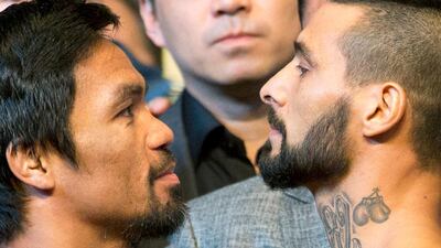 Manny Pacquiao and Lucas Matthysse face off. AP Photo