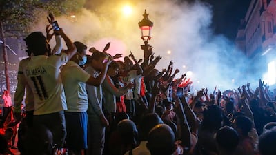 Paris Saint-Germain fans on the Champs Elysee in Paris. AP