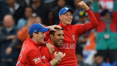 Ravi Bopara, centre, was the destroyer-in-chief, accounting for the wickets of Dhawan, Raina and Dhoni. Paul Ellis / AFP