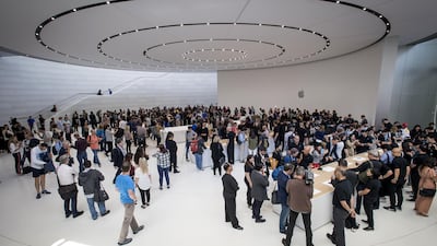 Attendees browse new products on display during an Apple Inc. event at the Steve Jobs Theater in Cupertino, California, U.S., on Wednesday, Sept. 12, 2018. Apple Inc. took the wraps off a renewed iPhone strategy on Wednesday, debuting a trio of phones that aim to spread the company's latest technology to a broader audience. Photographer: David Paul Morris/Bloomberg