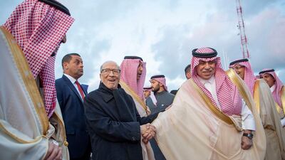 King Salman is welcomed by President Essebsi upon his arrival. EPA