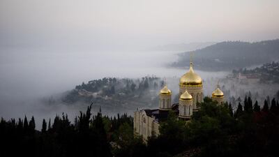 Fog forms beneath the Gorny Convent of the Russian Orthodox Church in Ein Kerem, an ancient village near Jerusalem. Dusan Vranic / AP