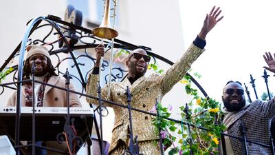Trombone Shorty rides Louisiana's Celebration Gator float. AP