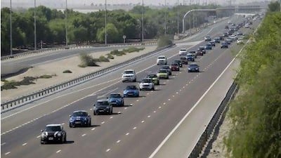 Minis from around the GCC travel in convoy along Sheikh Zayed Road before gathering at Dubai Autodrome.