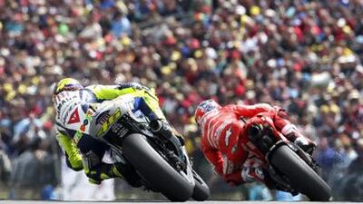 Yamaha's rider Valentino Rossi of Italy, left, and Ducati's Casey Stoner of Australia compete during last year?s German Grand Prix.