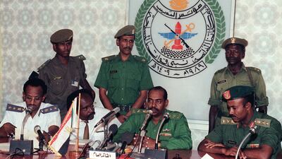 Revolutionary Council ruler and military coup leader General Omar Al-Beshir (Umar Hassan Ahmad al-Bashir) announces the formation of a new govenrment on July 8, 1989 in Khartoum. Omar Al-Beshir took power after toppling the civilian government of Prime minister Sadiq Al-Mahdi in a coup on June 30, 1989. (Photo by MIKE NELSON / AFP)