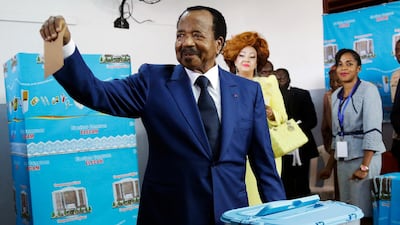 Cameroon's Incumbent President Paul Biya, of the Cameroon People's Democratic Movement party, casts his vote during the Presidential elections in Yaounde, Cameroon. AP