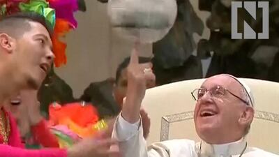 Pope Francis twirls a ball.