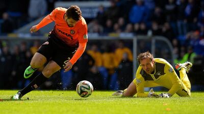 Nadir Ciftci of Dundee United takes the ball around Rangers keeper Steve Simonsen to score during the William Hill Scottish Cup semi-final in Glasgow, Scotland. Mark Runnacles / Getty Images