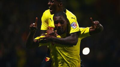 Odion Ighalo of Watford, front, celebrates with Lloyd Dyer as he scores their first goal in a win over Brentford in the Championship on Tuesday night. Ian Walton / Getty Images / September 30, 2014