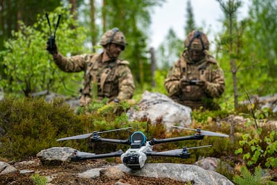 British soldiers learning to operate a drone. PA