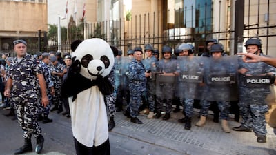 A Lebanese anti-government protester dressed in a panda suit takes part in demonstration outside the Lebanon Bar Associations in the capital Beirut. AFP