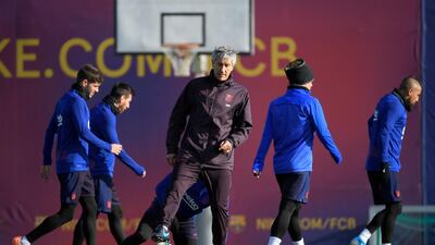 Barcelona manager Quique Setien (C), attends a training session at Joan Gamper Sports City. AFP