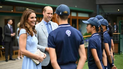 Britain's Prince William and Kate, Duchess of Cambridge meet ballboys and ballgirls, from left, Tom Hubner, 15, Rhianne Black, 14, Kayleigh Man, 13 and Cassius Hayman, 15, ahead of the Men's Singles Final on day thirteen of the Wimbledon Championships at the All England Lawn Tennis and Croquet Club, in London, Sunday, July 14, 2019. Photo: AP