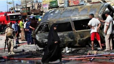 People inspect the site of a car bomb explosion in Basra, 550 kilometres southeast of Baghdad.