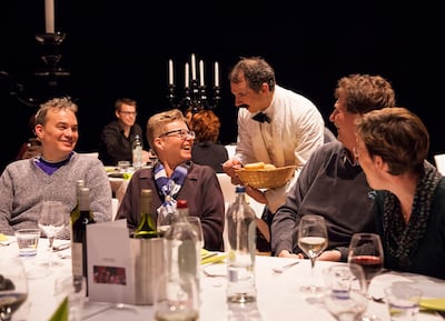 Guests are served by Manuel on the Faulty Towers Dining Experience. Courtesy Theatre by QE2