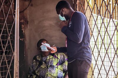 A Follow The Money Champion interviewing a beneficiary of food package in Nigeria’s capital, Abuja. CODE/Jide Ojediran