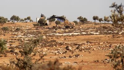Turkish army excavators at work on a hill in the Syrian border town of Salwah on October 14, 2017, as Ankara deployed its forces in Idlib province to monitor a de-escalation agreement agreed upon with Russia and Iran. Omar Haj Kadour / AFP