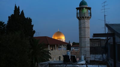 The minaret of a mosque and the Dome of the Rock (background) in a Palestinian neighbourhood of east Jerusalem's Old City. Ahmad Gharabli/AFP