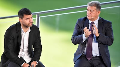 Sergio Aguero and Barcelona president Joan Laporta. AFP