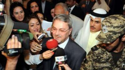 Mohammed Hussein Bahr al Ulum is swarmed by journalists on his arrival in Kuwait.