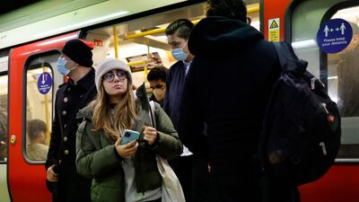 Commuters get out of a Tube at the Liverpool Street station in east London. (Photo by Tolga Akmen / AFP)