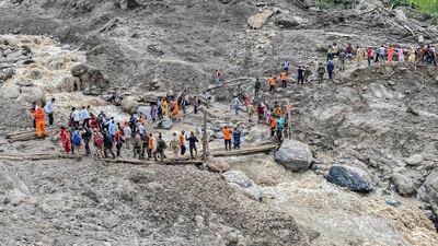 India's National Disaster Response Force and security personnel rescue Hindu pilgrims following a flash flood in Kishtwar district. AFP