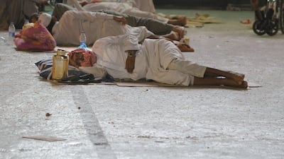 Muslim pilgrims sleep near the Grand Mosque in the holy city of Mecca. Haj draws three million visitors each year, making it the largest yearly gathering of people in the world. AP Photo / Amr Nabil