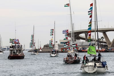Boats from the flotilla leave Barcelona's Port Vell earlier this month. EPA
